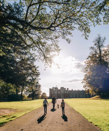 Family walking toward the Palace, in Sunshine