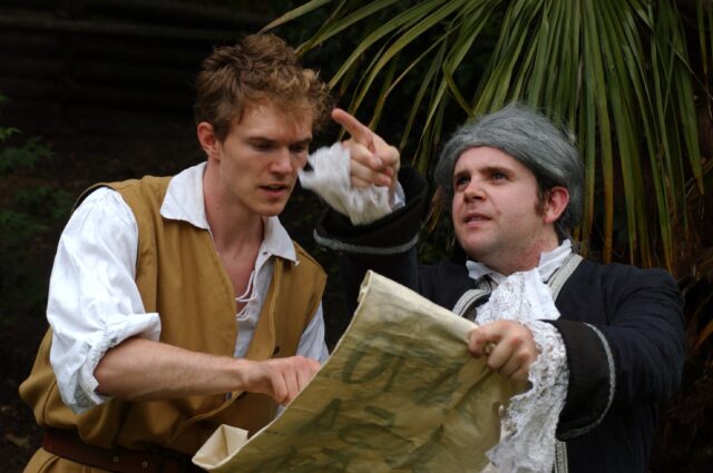Looking at the treasure map with the squire